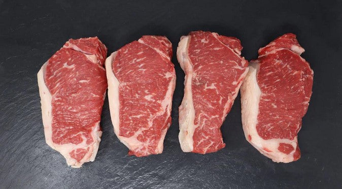 4 Aged Boneless Rib-Eye Steaks & 1 Rack Of Beef Back Ribs